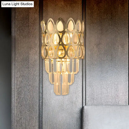 Contemporary black & gold sconce with teardrop crystals living room