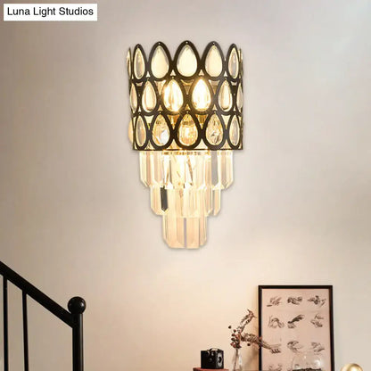 Contemporary black & gold sconce with teardrop crystals living room
