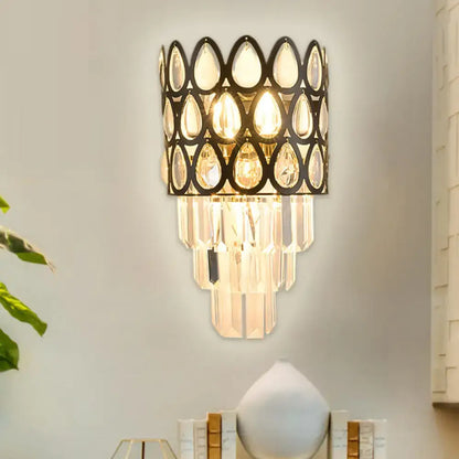 Contemporary black & gold sconce with teardrop crystals living room