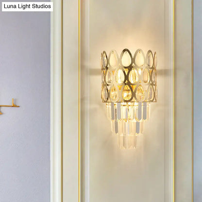 Contemporary black & gold sconce with teardrop crystals living room