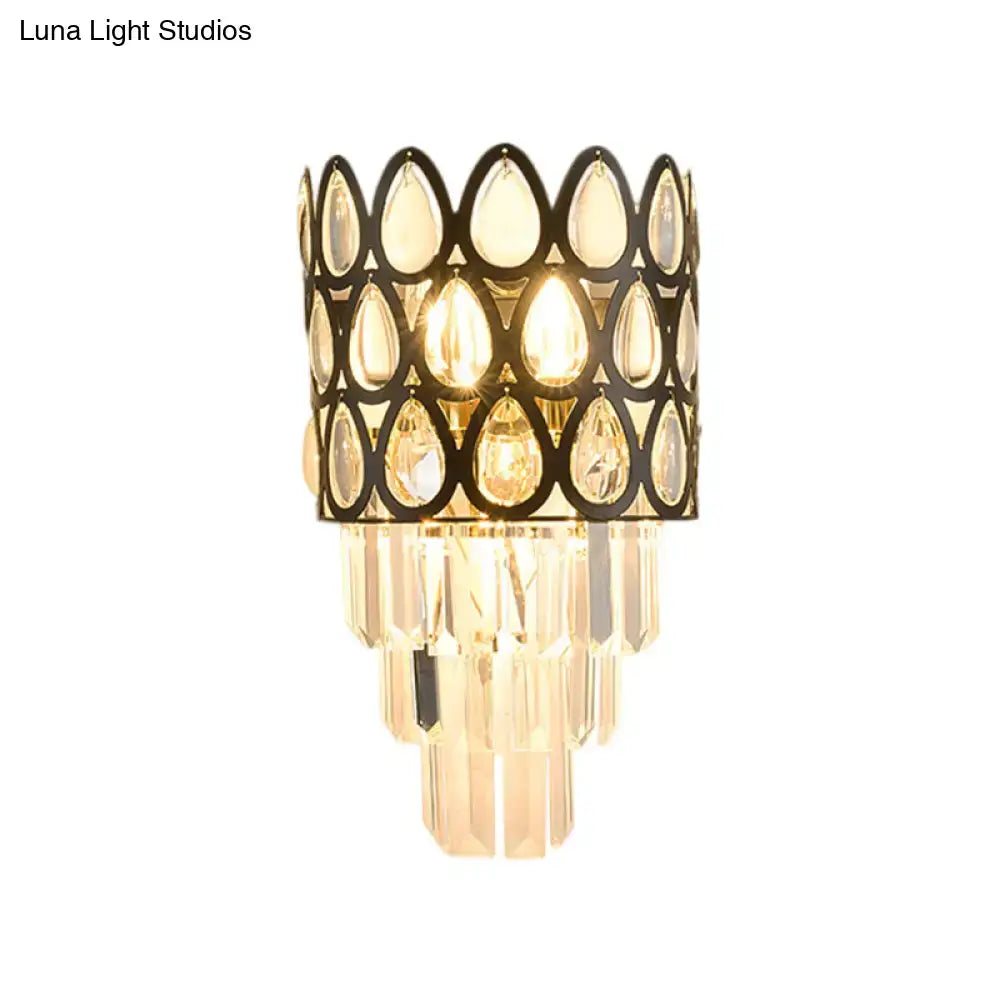 Contemporary black & gold sconce with teardrop crystals living room