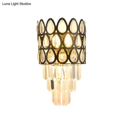 Contemporary black & gold sconce with teardrop crystals living room