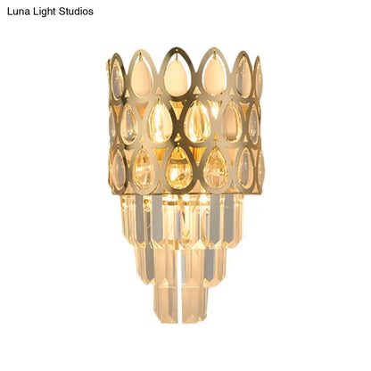 Contemporary black & gold sconce with teardrop crystals living room