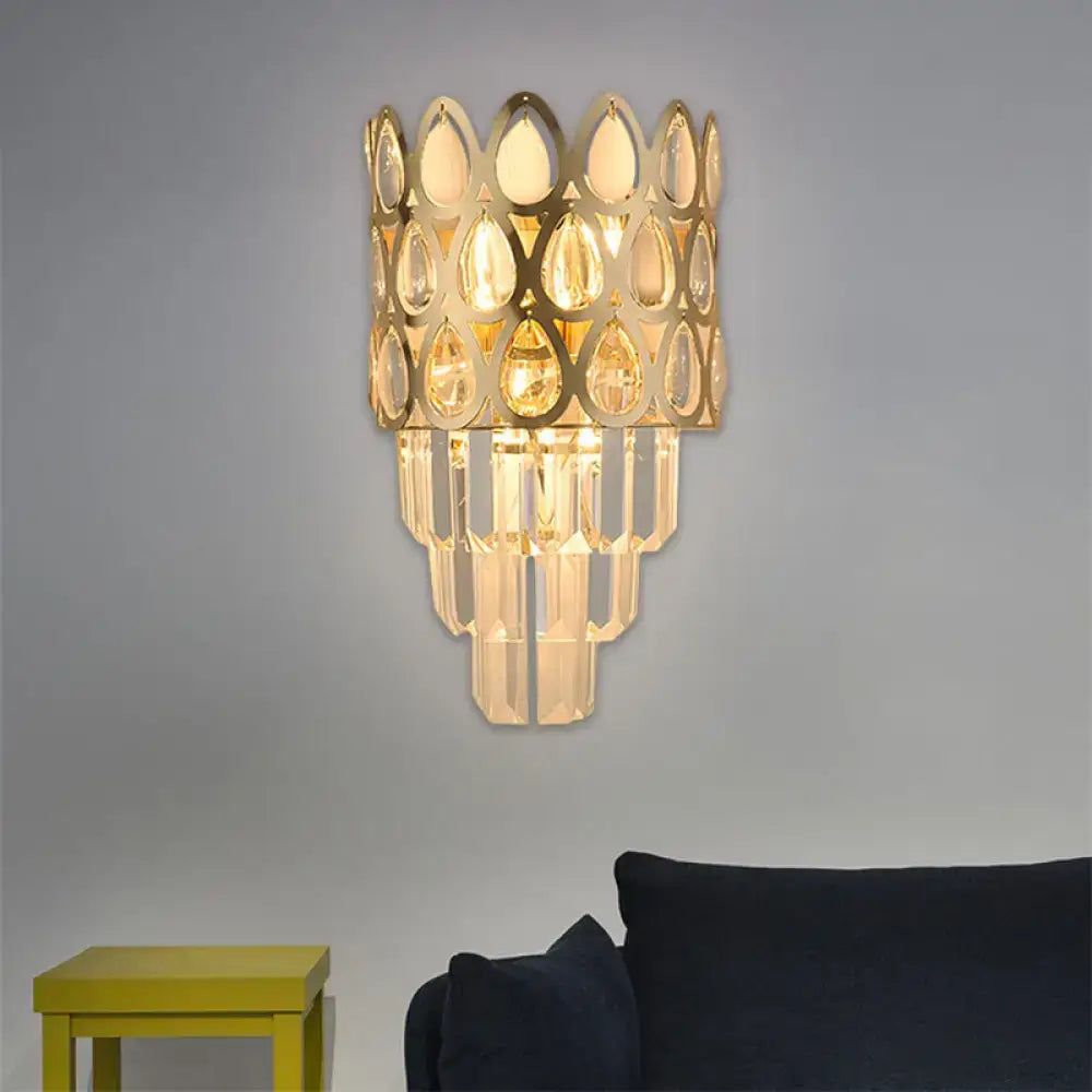 Contemporary black & gold sconce with teardrop crystals living room