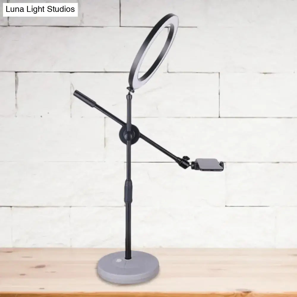 Contemporary black round shaped metal vanity light bedroom phone stand