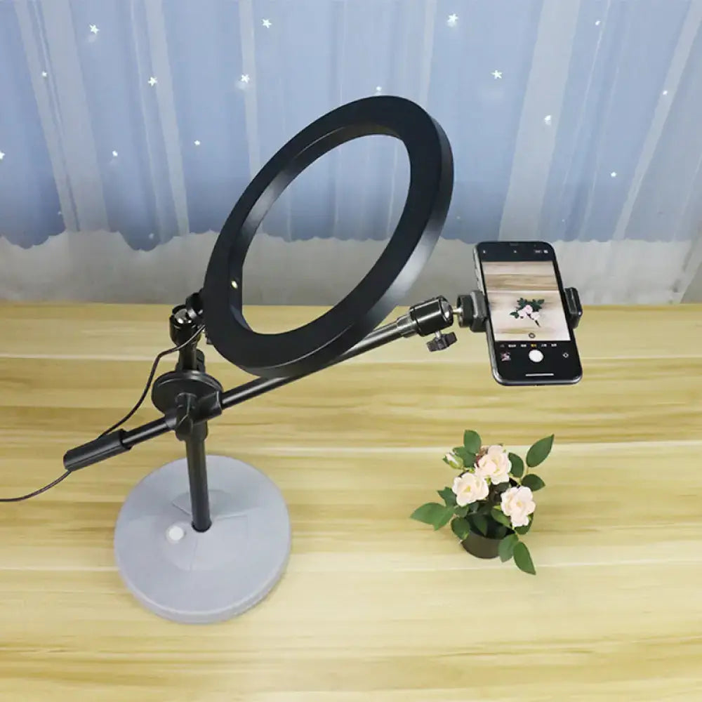 Contemporary black round shaped metal vanity light bedroom phone stand