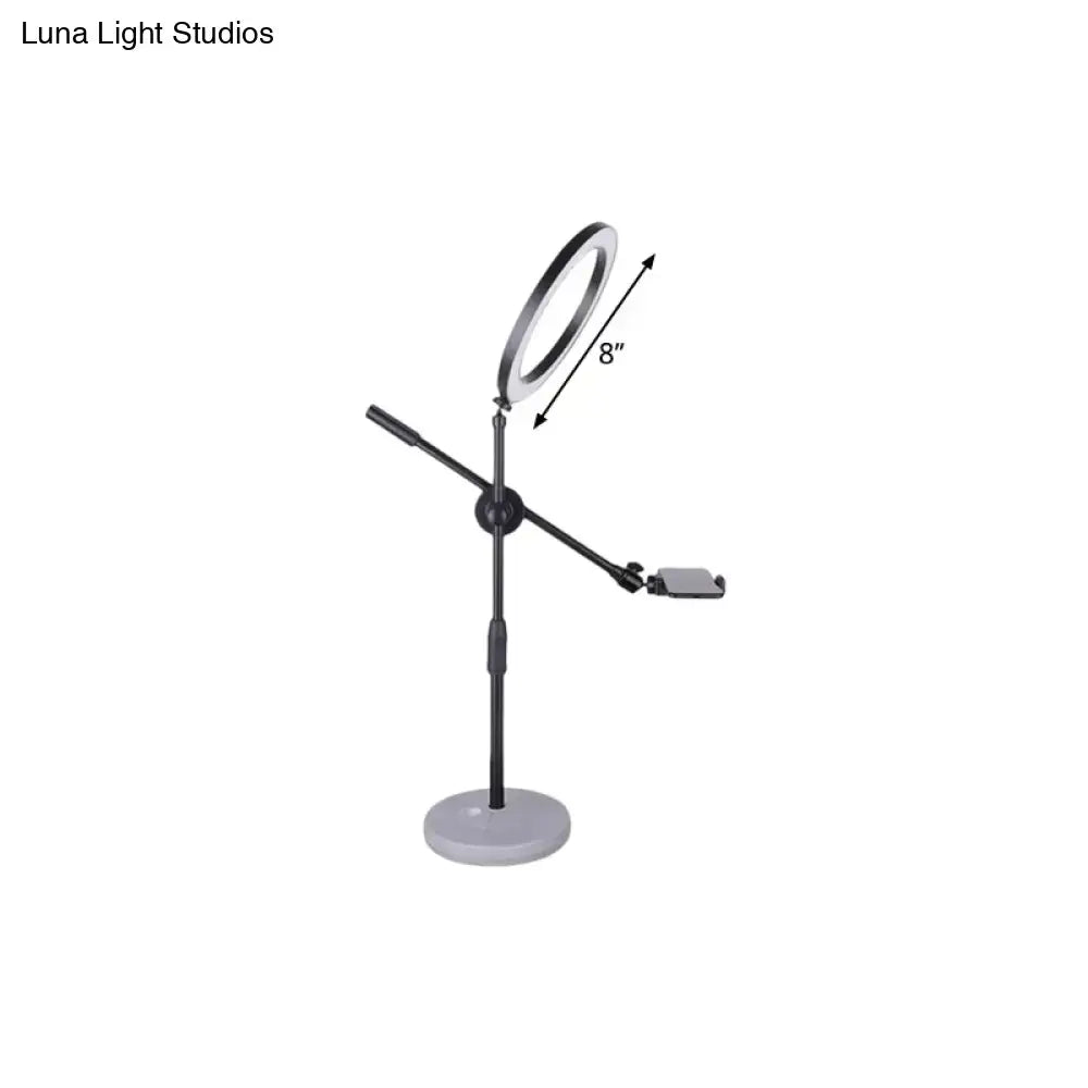 Contemporary black round shaped metal vanity light bedroom phone stand