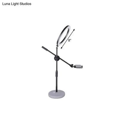 Contemporary black round shaped metal vanity light bedroom phone stand