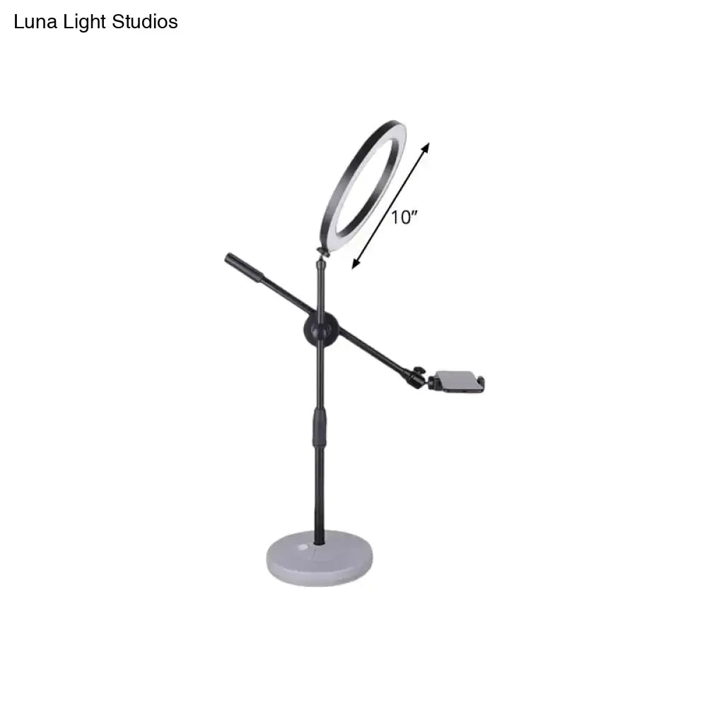Contemporary black round shaped metal vanity light bedroom phone stand