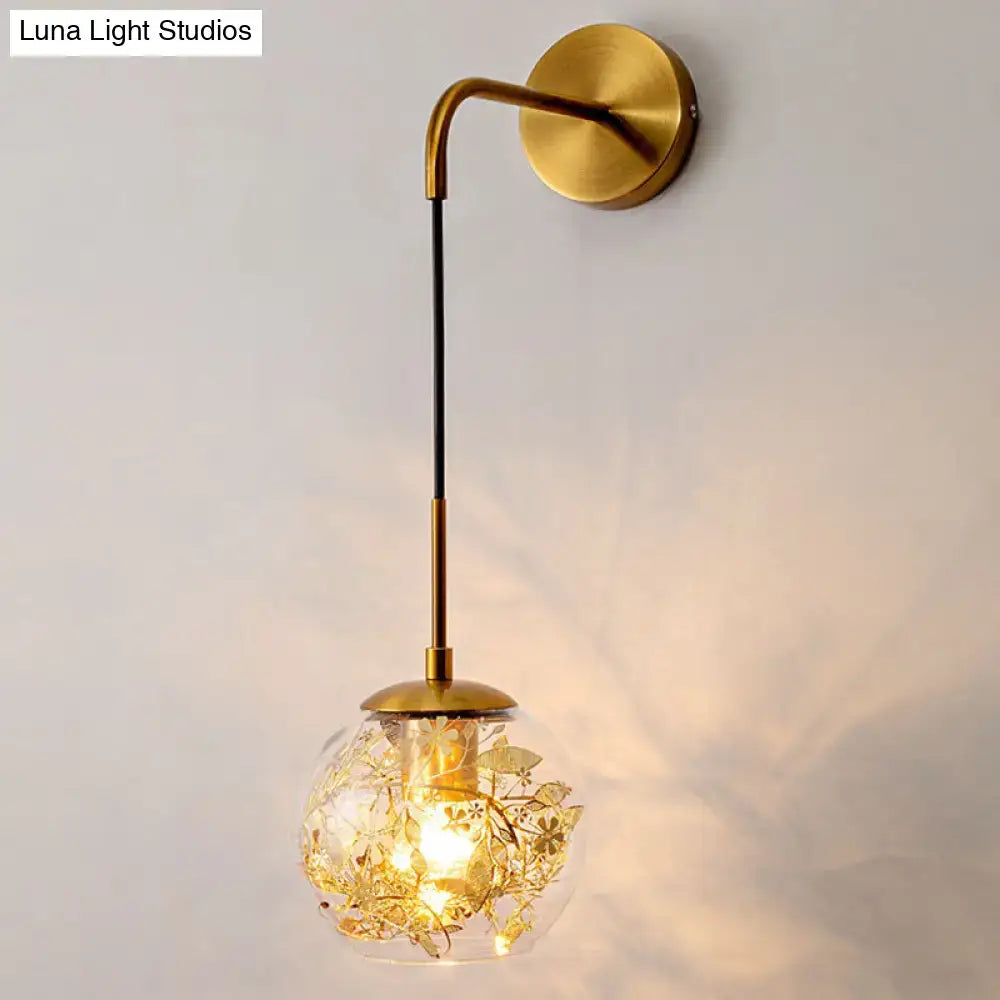Contemporary brass clear glass wall lamp with foil flower decor bedroom