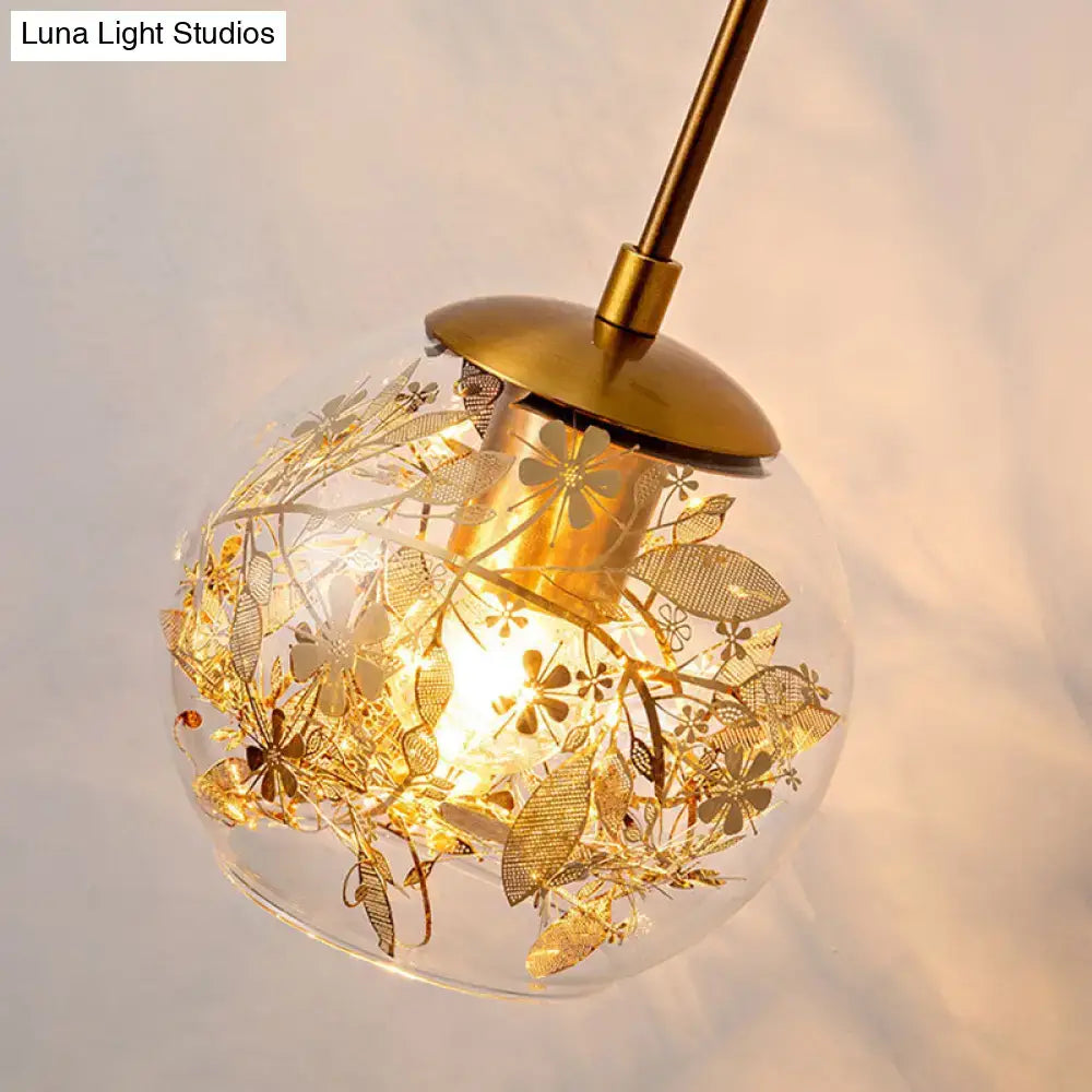 Contemporary brass clear glass wall lamp with foil flower decor bedroom