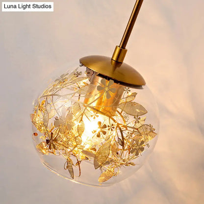 Contemporary brass clear glass wall lamp with foil flower decor bedroom