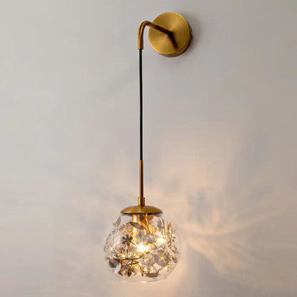 Contemporary brass clear glass wall lamp with foil flower decor bedroom