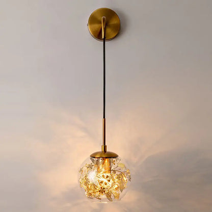 Contemporary brass clear glass wall lamp with foil flower decor bedroom