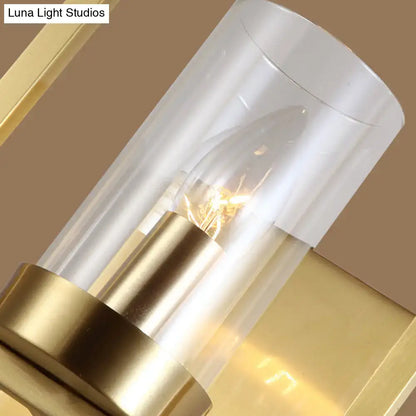 Contemporary brass wall light clear glass cylinder bedroom light fixture