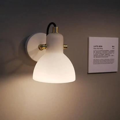 Contemporary brass & white glass wall lamp for bedroom with adjustable arm