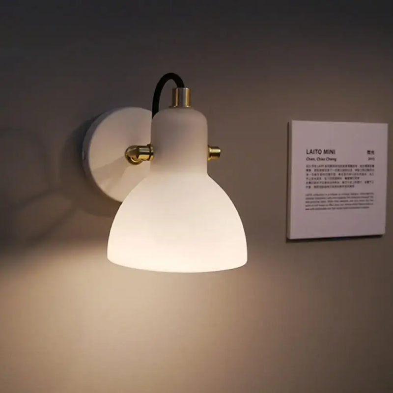 Contemporary brass & white glass wall lamp for bedroom with adjustable arm