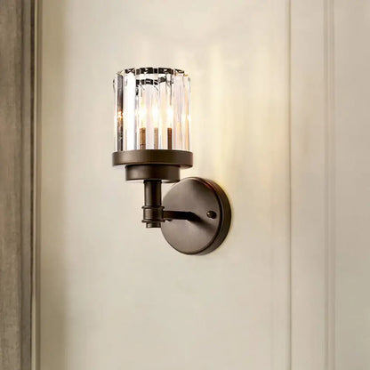 Contemporary bronze wall sconce with ribbed crystal shade hallway light fixture
