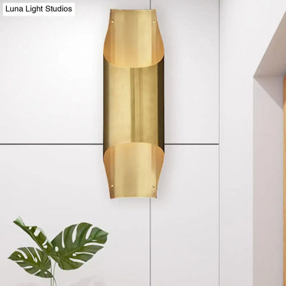 Contemporary curved brass wall lamp for living room
