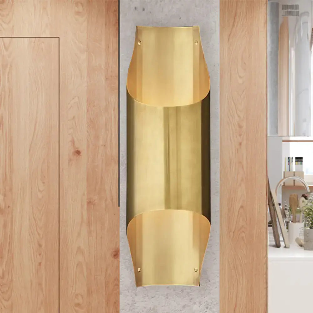 Contemporary curved brass wall lamp for living room