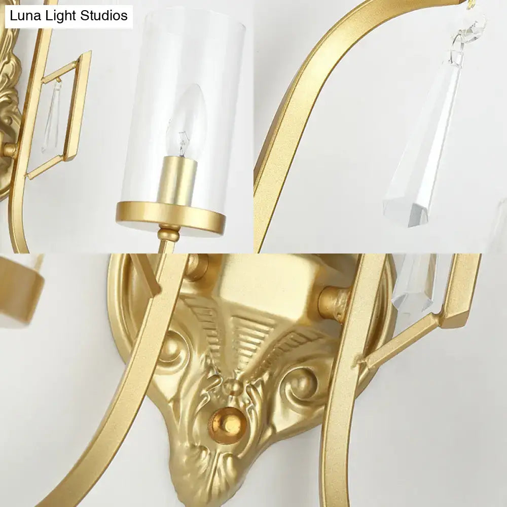 Contemporary gold wall light bedroom sconce with clear glass shade