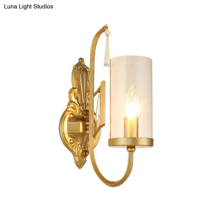 Contemporary gold wall light bedroom sconce with clear glass shade
