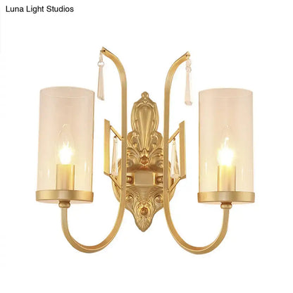 Contemporary gold wall light bedroom sconce with clear glass shade
