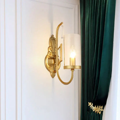 Contemporary gold wall light bedroom sconce with clear glass shade
