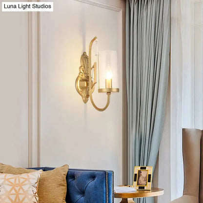 Contemporary gold wall light bedroom sconce with clear glass shade
