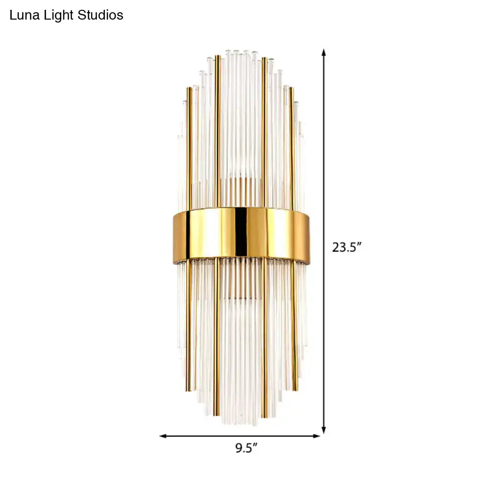 Contemporary gold wall light with clear crystal shade – living room