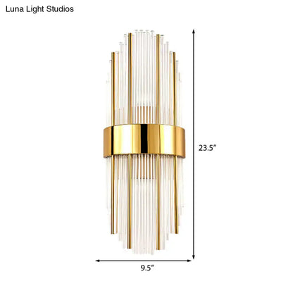 Contemporary gold wall light with clear crystal shade – living room