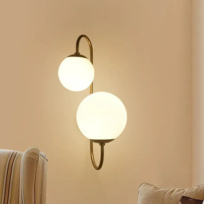 Contemporary gold wall sconce bedroom light with opal glass shade