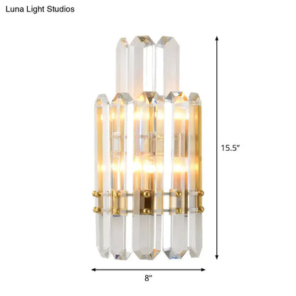 Contemporary gold wall sconce with clear crystal prisms for dining room