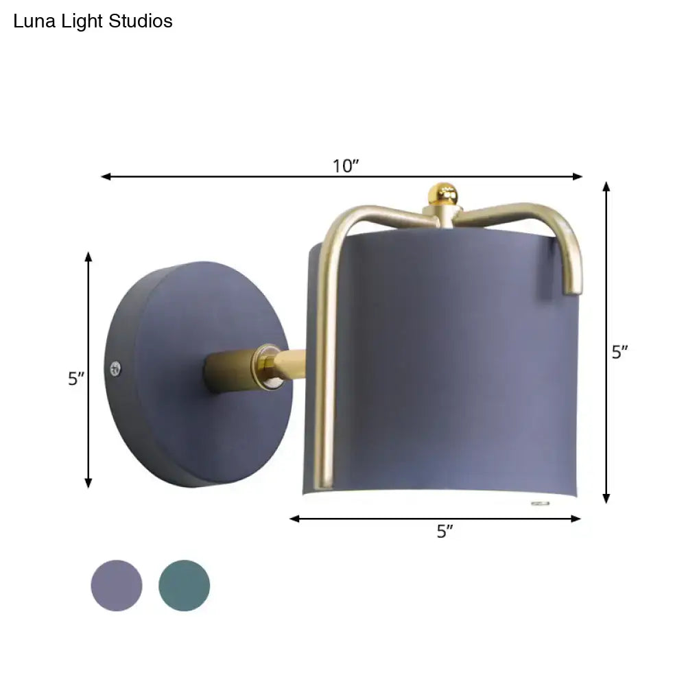 Contemporary green & grey sconce with brass accents for bedroom