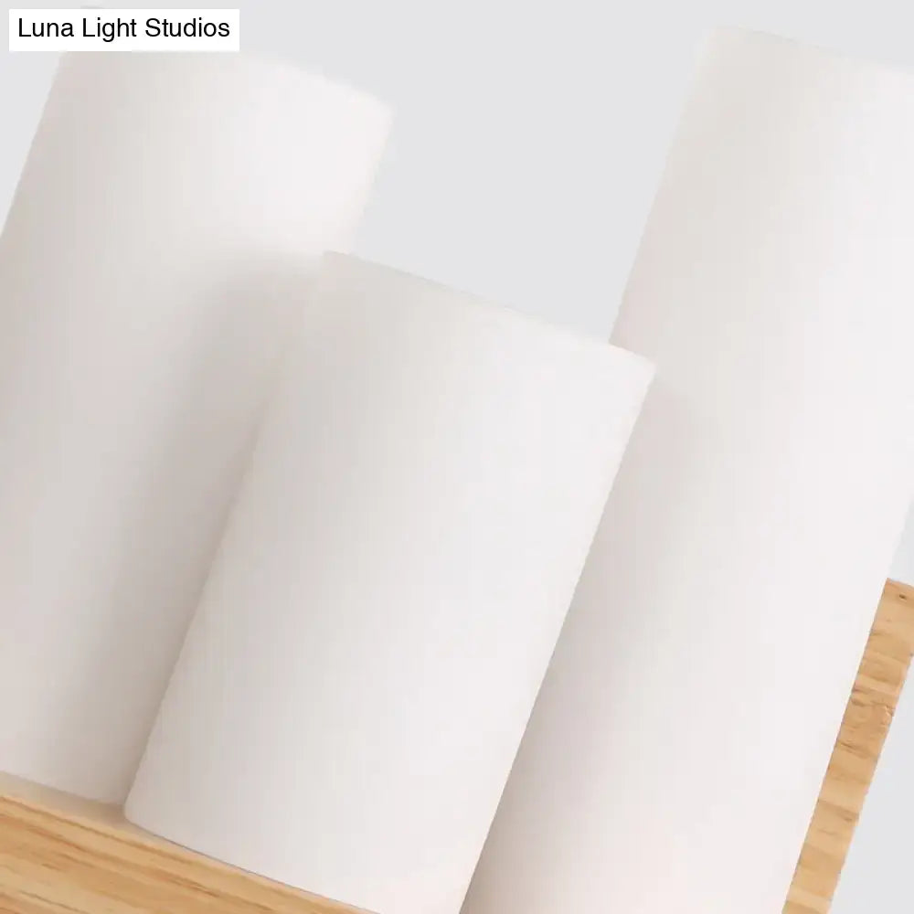 Contemporary tube shade wall lamp with wooden shelf for cloth shop