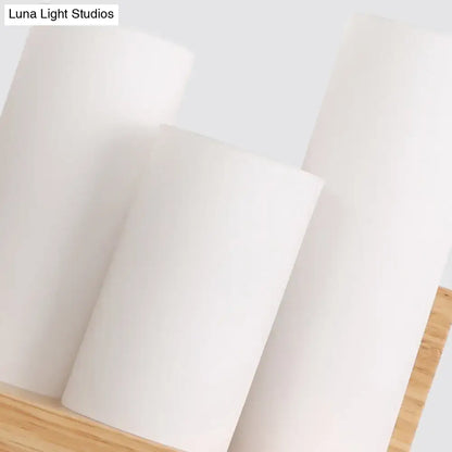 Contemporary tube shade wall lamp with wooden shelf for cloth shop