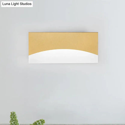 Contemporary white & gold bedroom sconce with warm color temperature