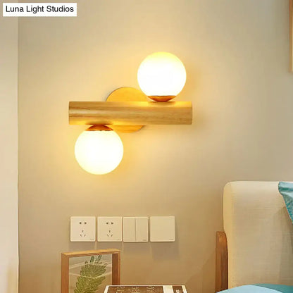 Contemporary white milk glass wall lamp with wooden base for bathroom