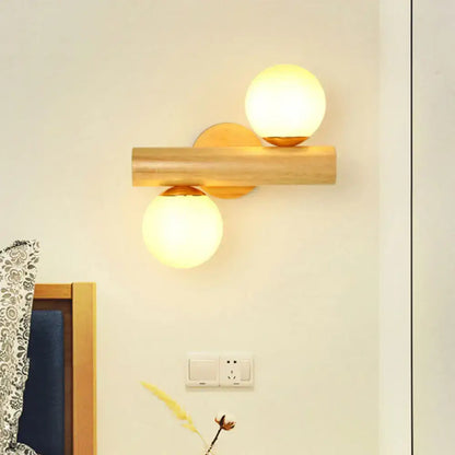 Contemporary white milk glass wall lamp with wooden base for bathroom