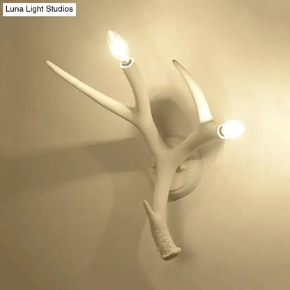 Contemporary white resin antler wall sconce for restaurant dining room