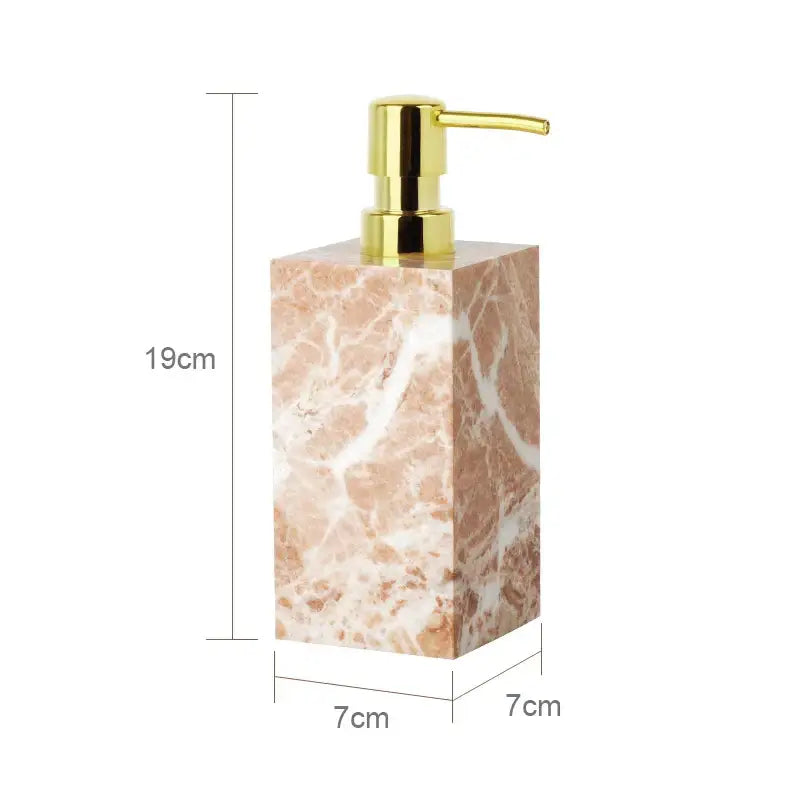 Coral pink marble bathroom accessories set with gold accents