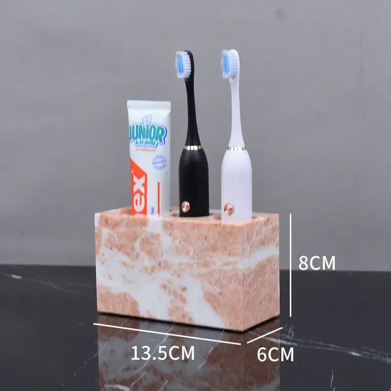 Coral pink marble bathroom accessories set with gold accents