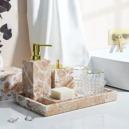 Coral pink marble bathroom accessories set with gold accents