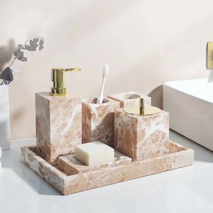 Coral pink marble bathroom accessories set with gold accents