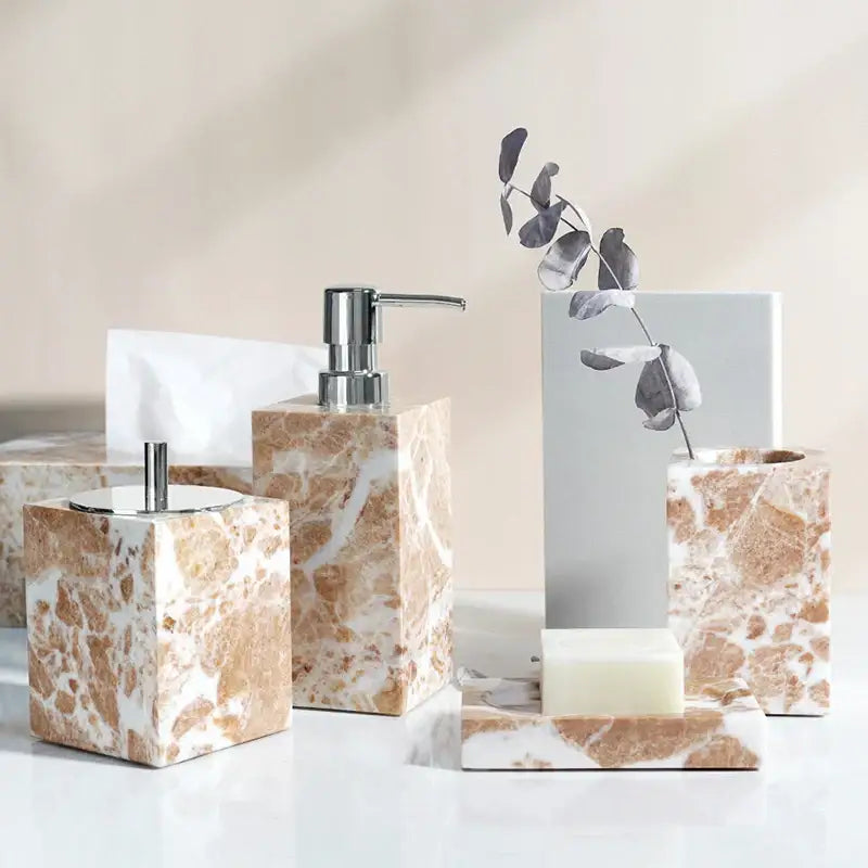 Coral pink marble bathroom accessories set with gold accents
