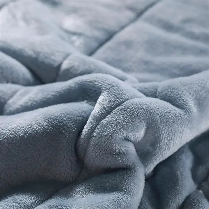 Cozy coral fleece blue and white quilted blanket for bedroom
