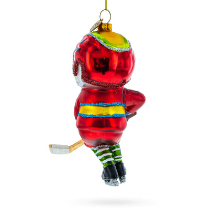 Snowman Playing Hockey Glass Christmas Ornament