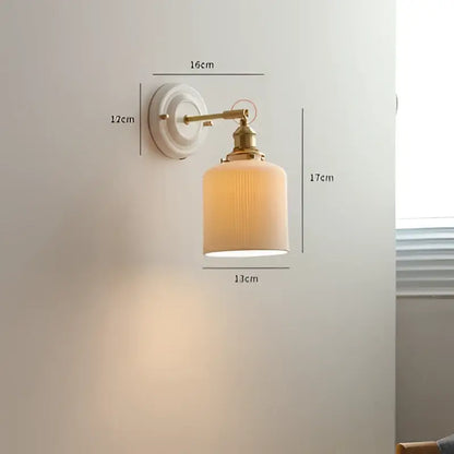 Cream ceramic led wall light with copper arm bedroom sconce