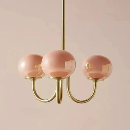 Cream pink bedroom pendant light with three glass globes and brass