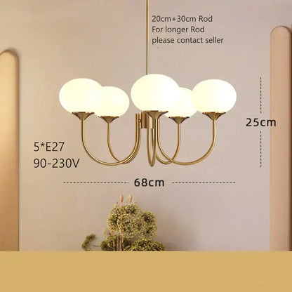Cream pink bedroom pendant light with three glass globes and brass